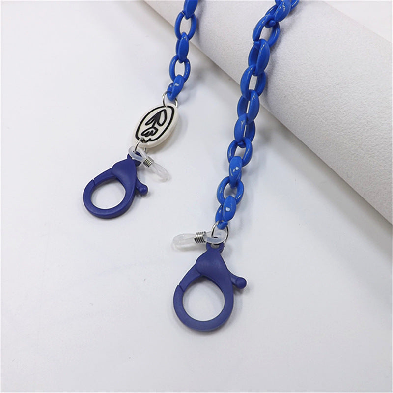 Close-up of stylish unisex plastic glasses chain, showing secure loops. Eyeglass holder fashion accessory.
