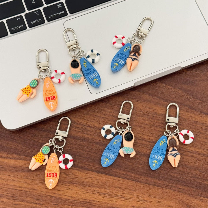 Durable plastic swimming keychain featuring a colorful surfboard charm, an ideal swimmer gift.