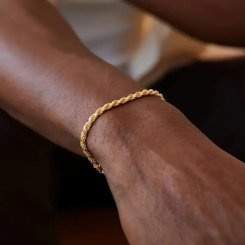 Modern unisex layered chain bracelet featuring unique textured links, a stylish accessory.
