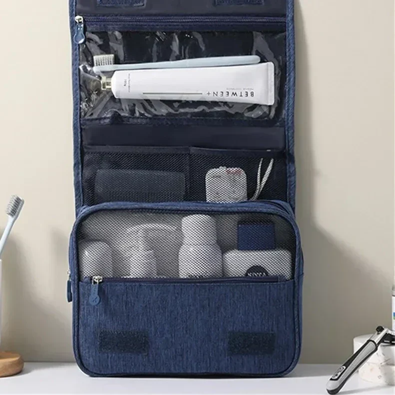Durable, water-resistant material of a unisex travel toiletry bag. Features a sturdy zipper & hanging hook for essentials.