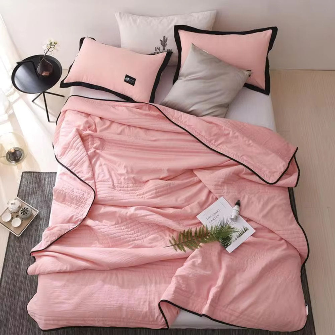 Unisex ultimate cooling blanket for hot sleepers, designed to prevent night sweats with breathable fabric.