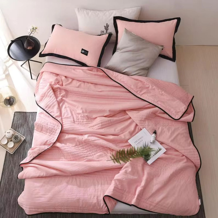 Unisex ultimate cooling blanket for hot sleepers, designed to prevent night sweats with breathable fabric.