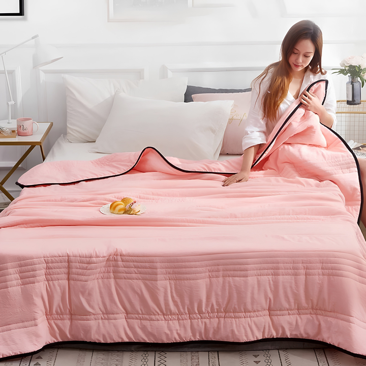 Ultimate cooling blanket for hot sleepers, designed to stop night sweats and provide comfortable temperature control.
