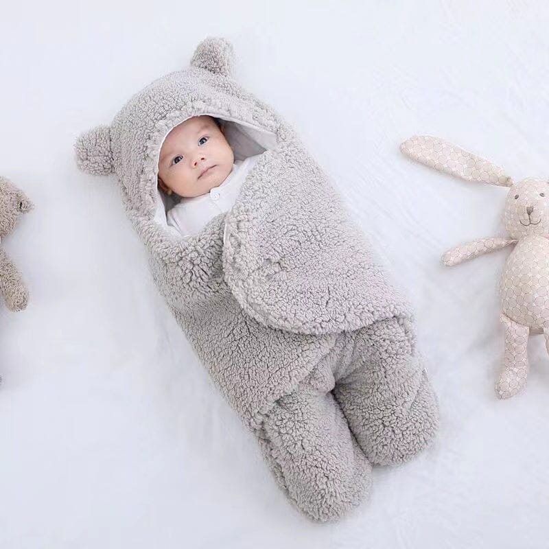 Plush ultra-soft baby swaddle, quilted for extra comfort & warmth. Features adorable bear ears for infants.