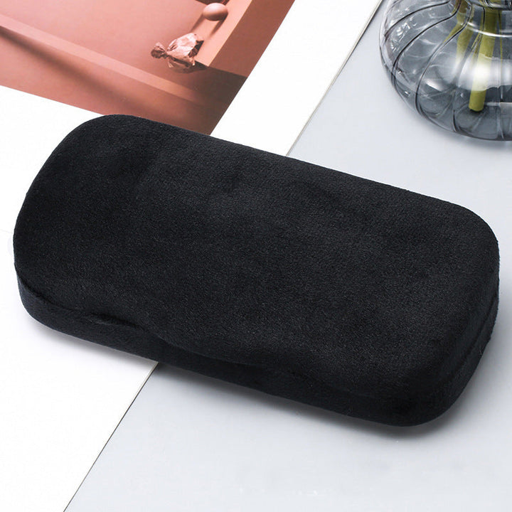 Compact black velvet eyeglass case, perfect for organizing & protecting sunglasses on the go.