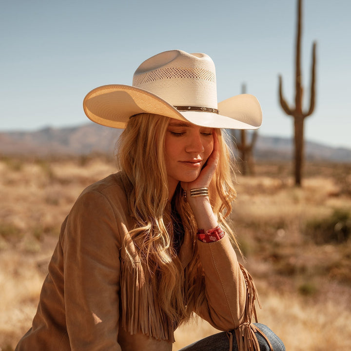 Breathable unisex western cowboy hat. Stylish leather band, silver accents. Ideal for summer sun protection & outdoor style.