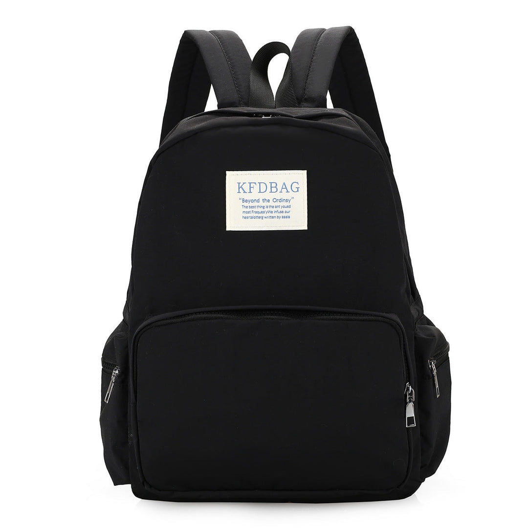 Person wearing a comfortable lightweight daily backpack, ideal for travel or campus, showcasing its versatile design.