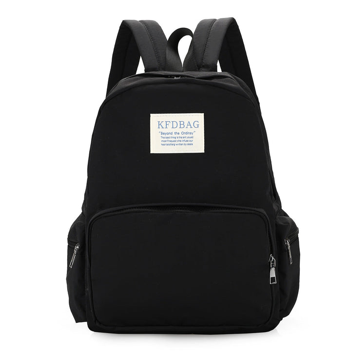 Person wearing a comfortable lightweight daily backpack, ideal for travel or campus, showcasing its versatile design.