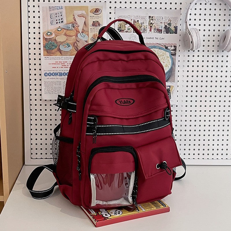 Model wearing a unisex outdoor travel backpack. Perfect for commuting, sports, and everyday use. Comfortable fit.