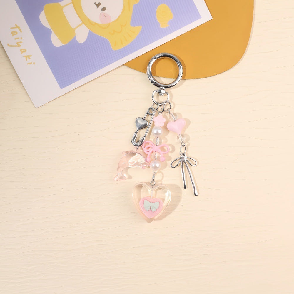 Colorful unisex bag accessory: a vibrant charm keychain, also serves as a key holder.