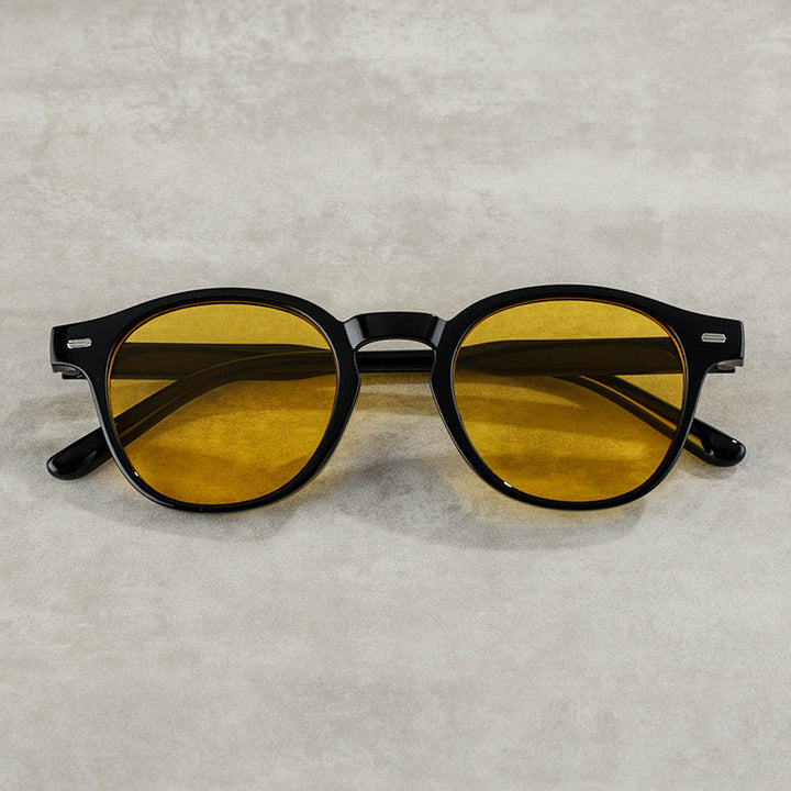 Retro-inspired round sunglasses, unisex design, featuring full UV eye protection for sunny days.