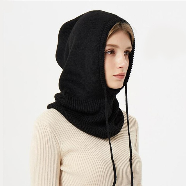 Unisex warm knitted winter hat with drawstrings, perfect for cold weather headwear.