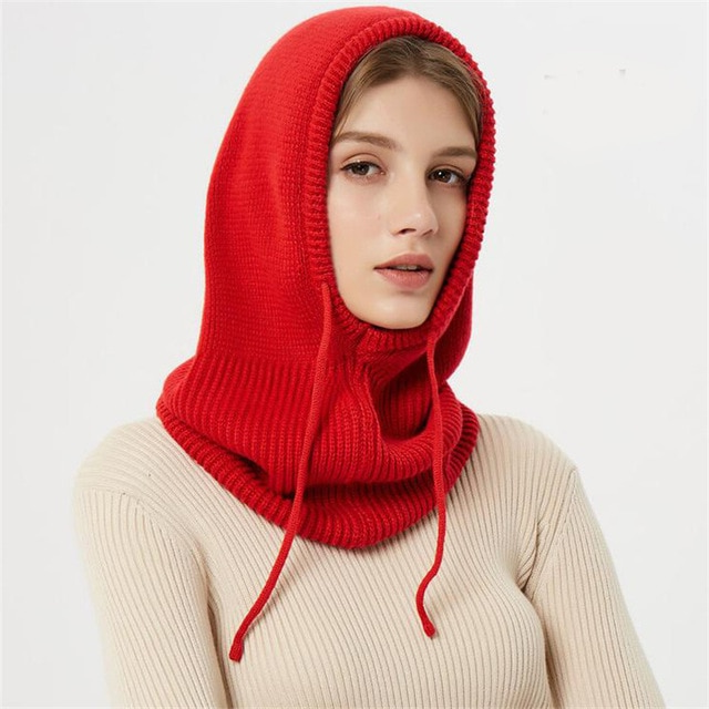 Cozy knitted beanie, a warm unisex hat with drawstrings, ideal for winter fashion.