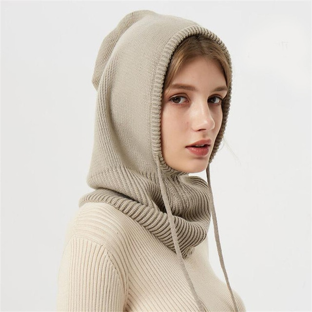 Knitted winter hat with drawstrings, offering ultimate warmth and comfort in cold weather.