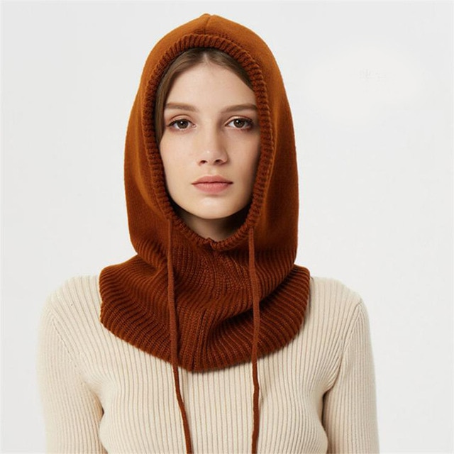 Fashionable unisex knitted beanie with drawstrings, a cozy and warm accessory for winter style.