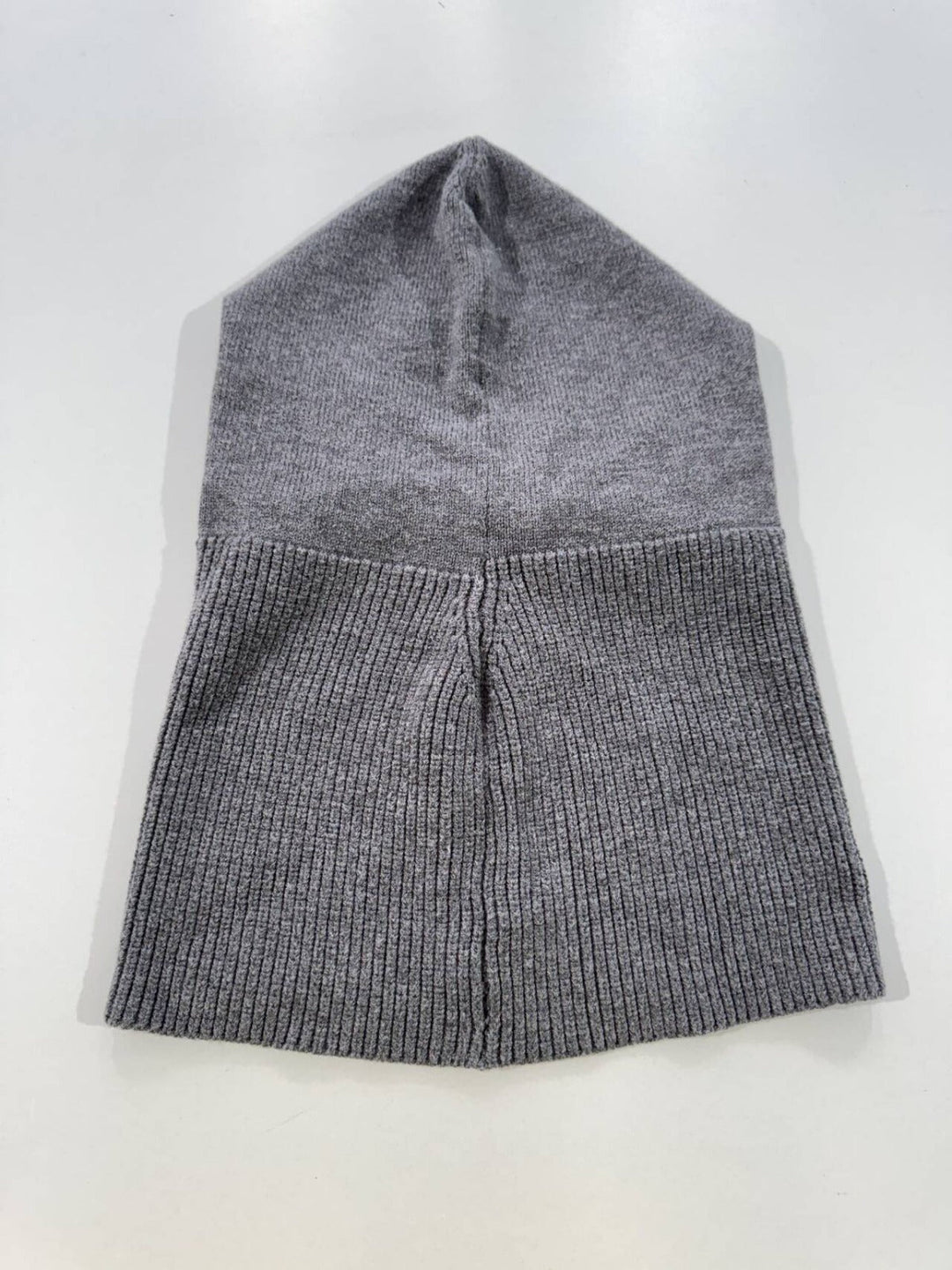 Essential winter hat: warm knitted beanie with drawstrings for versatile unisex cold weather headwear.