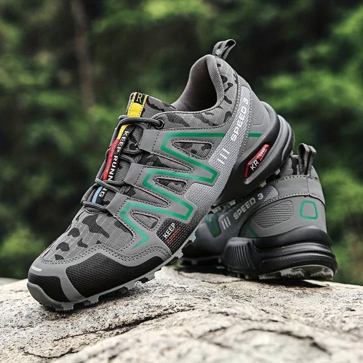 Green unisex waterproof hiking boots, ideal for rugged mountain trails. Durable outdoor footwear for trekking & adventure.