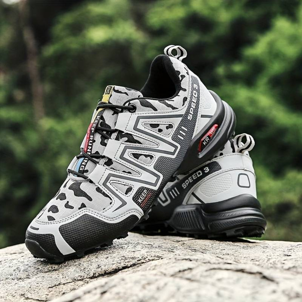 Grey unisex hiking boots, waterproof & comfortable for mountain trails. Durable outdoor trekking adventure gear.
