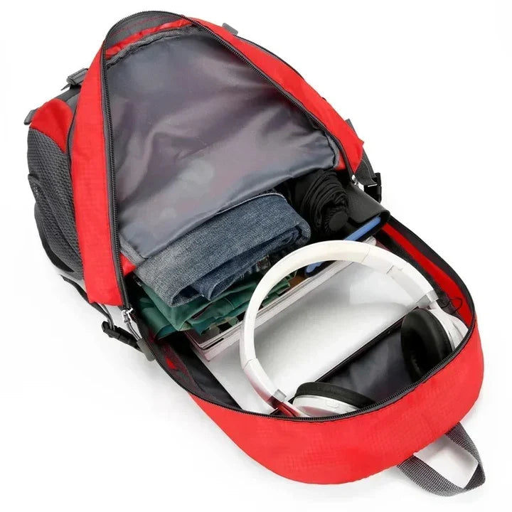 High-capacity waterproof travel backpack, unisex, designed for outdoor use with numerous pockets.