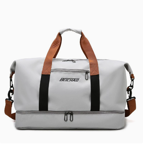Modern black travel duffel bag for men & women, with shoe storage & trolley sleeve, sleek and functional.