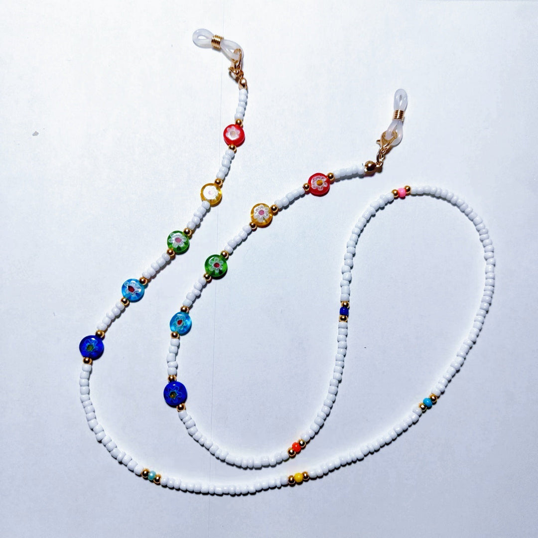 Minimalist white bead glasses chain, a practical non-slip holder for securing eyewear.