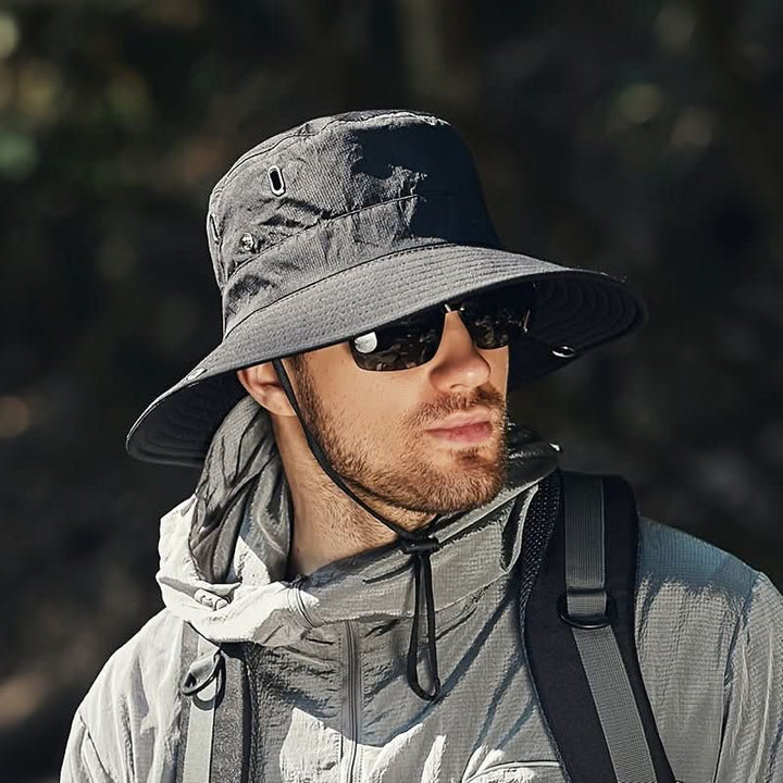 Unisex wide brim ventilated sun hat with adjustable chin strap, ideal for outdoor activities & travel.