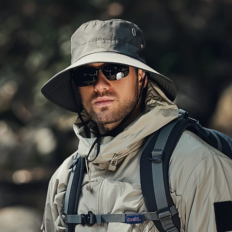 Lightweight outdoor sun hat: wide brim, ventilation & chin strap for hiking, fishing & summer adventures.