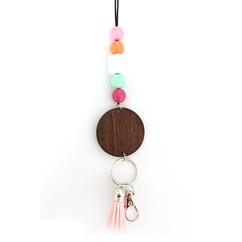 Close-up of a vibrant unisex wooden beaded keychain, showcasing handmade style, natural wood, and colorful beads.