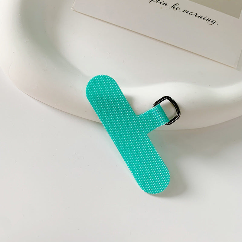 Universal fabric bookmark holder securing an open novel.