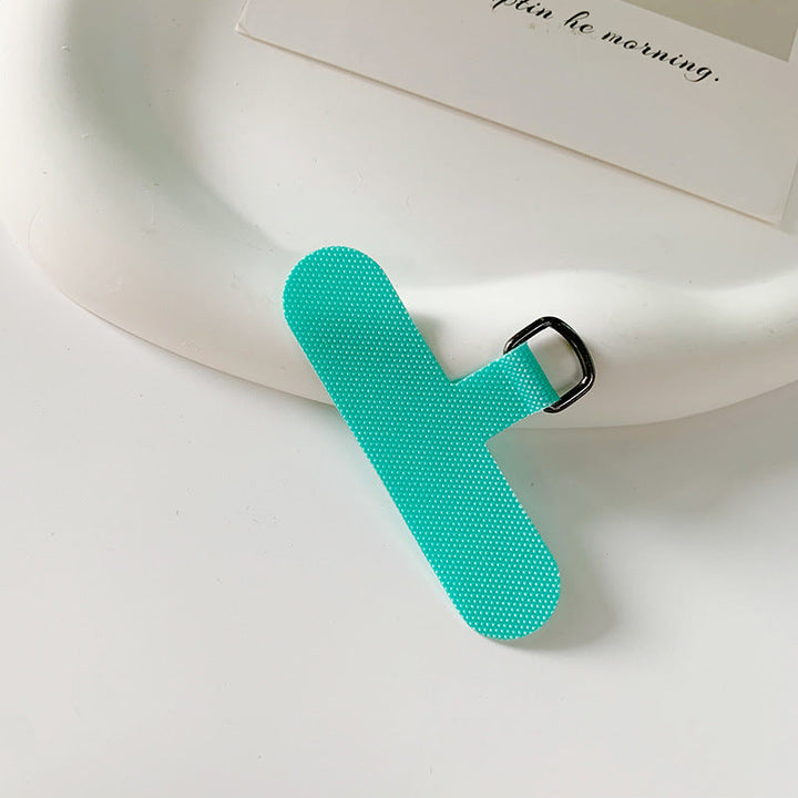 Universal fabric bookmark holder securing an open novel.