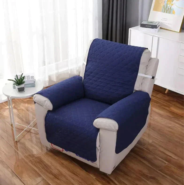 Easy care quilted sofa slipcover, universal fit for recliners, enhances home decor.