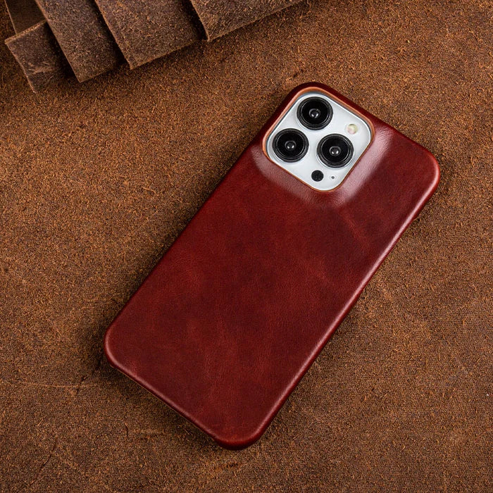 Stylish brown leather iPhone case, shock-absorbing protection & slim fit for Apple devices.