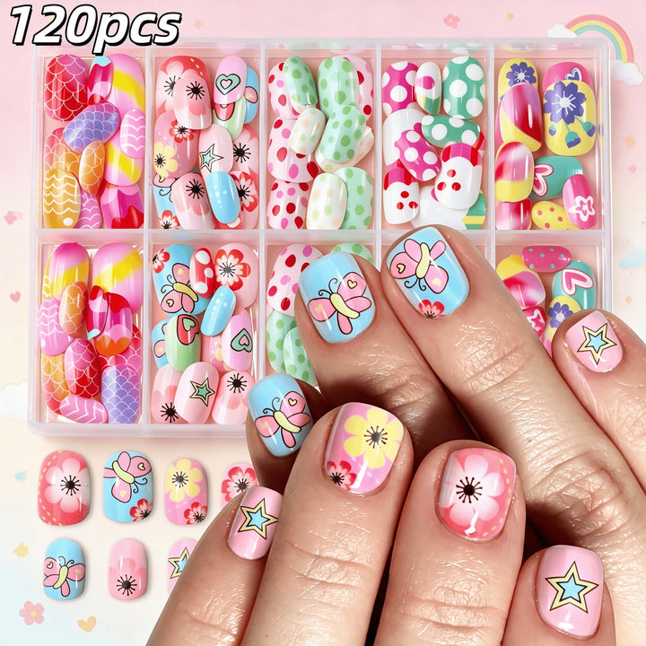 Close-up of vibrant cartoon press-on nails featuring playful characters & colorful patterns for a fun manicure.