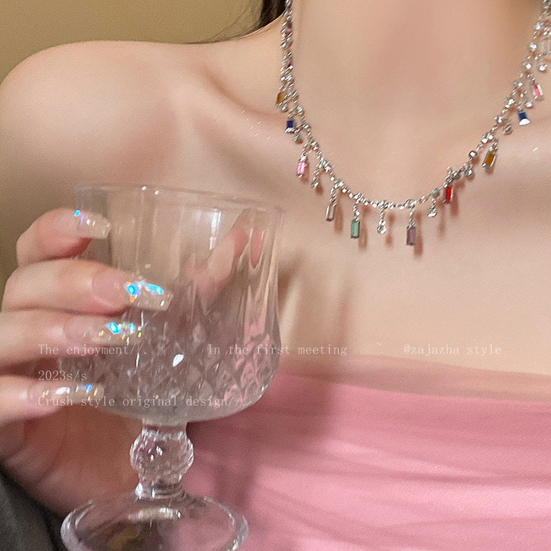 Women's Statement Charm Necklace, playful & elegant, with diverse vibrant charms. Adjustable fashion jewelry gift.