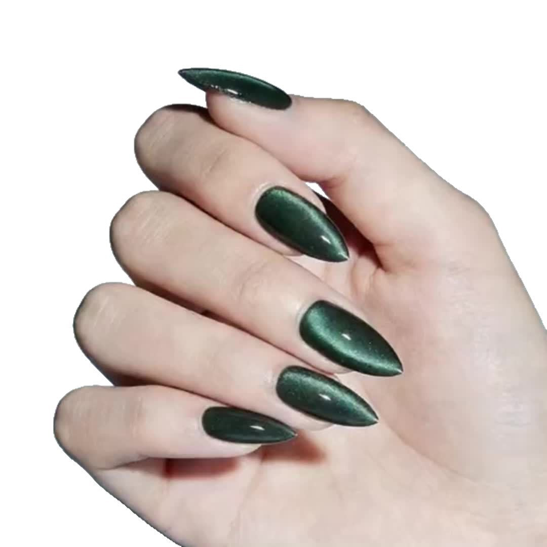 Close-up of a hand with vibrant dark green, chip-resistant nail polish, showcasing a long-lasting, glossy manicure.
