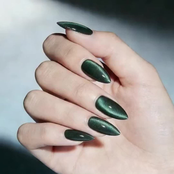 Vibrant dark green nail polish, formulated to be chip-resistant and long-lasting for a perfect women's manicure.