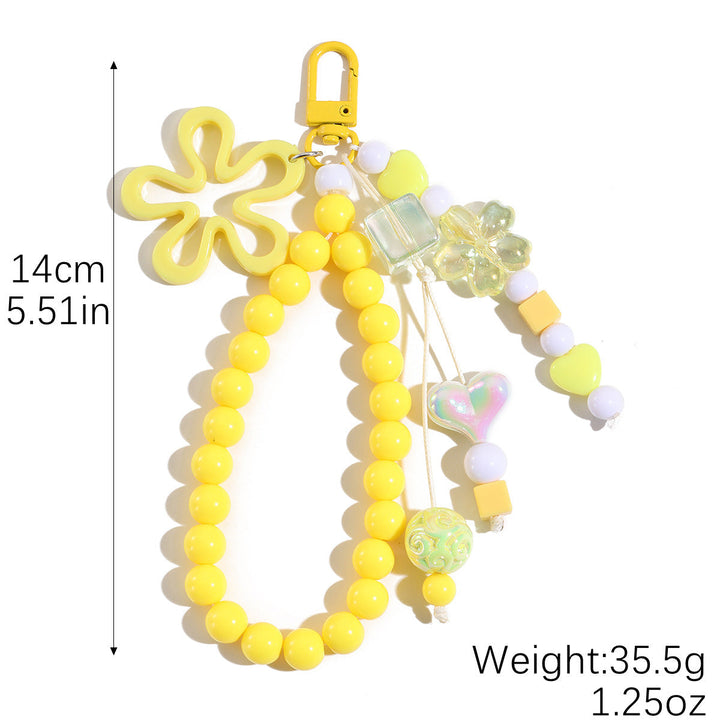 Detailed plastic floral butterfly keychain, a vibrant women's charm for keys & bags.