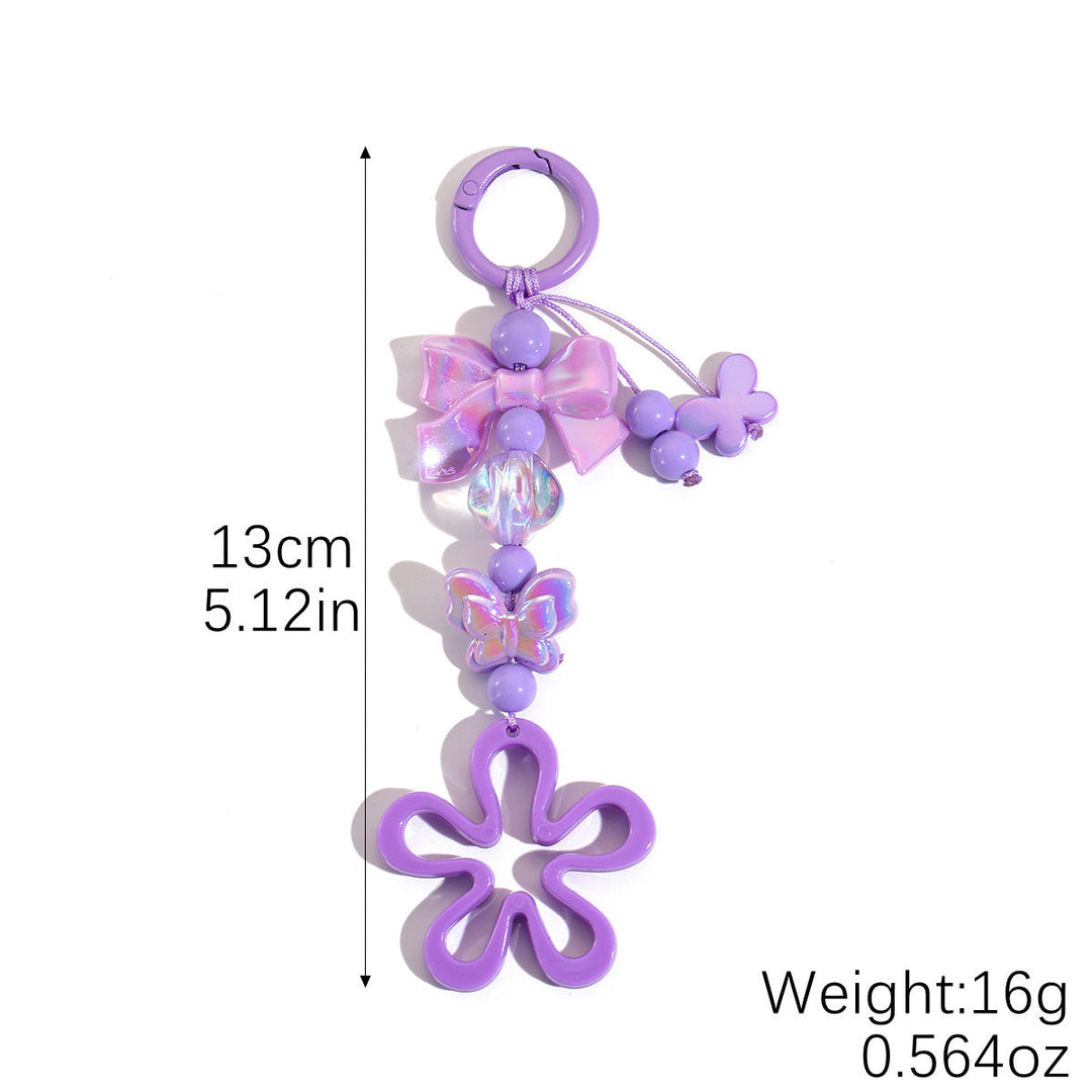 Vibrant floral butterfly key ring, a charming plastic accessory for keys or bag decor.
