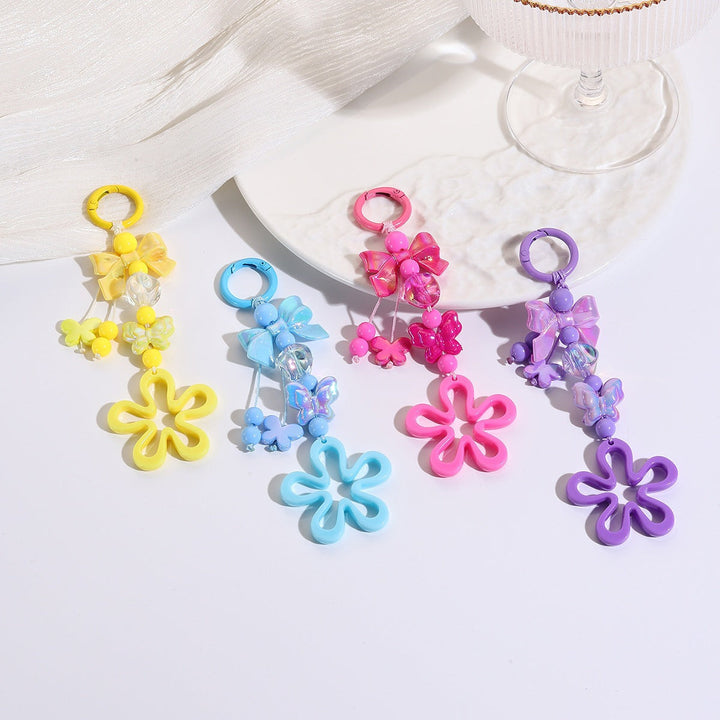 Unique plastic floral butterfly bag charm, a colorful and durable accessory.