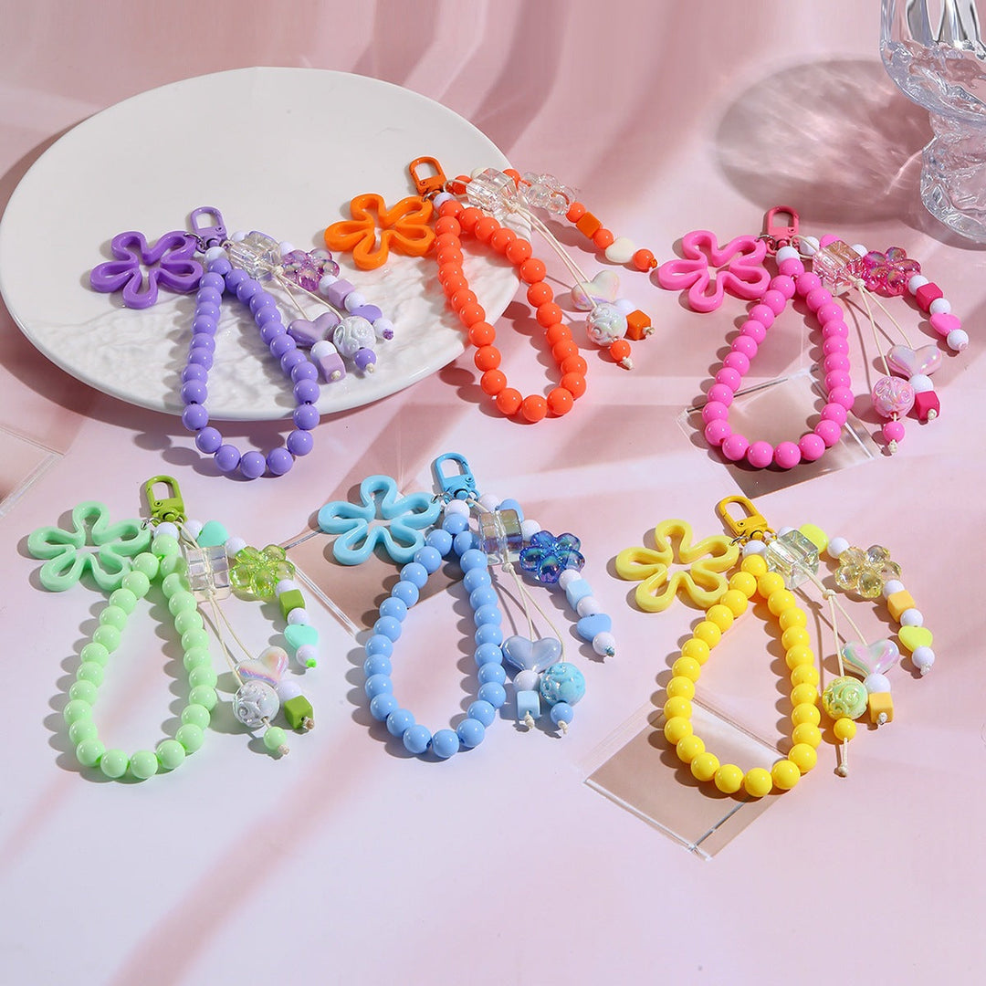 Women's multi-colored butterfly keychain with flower accents, ideal for keys & purses.