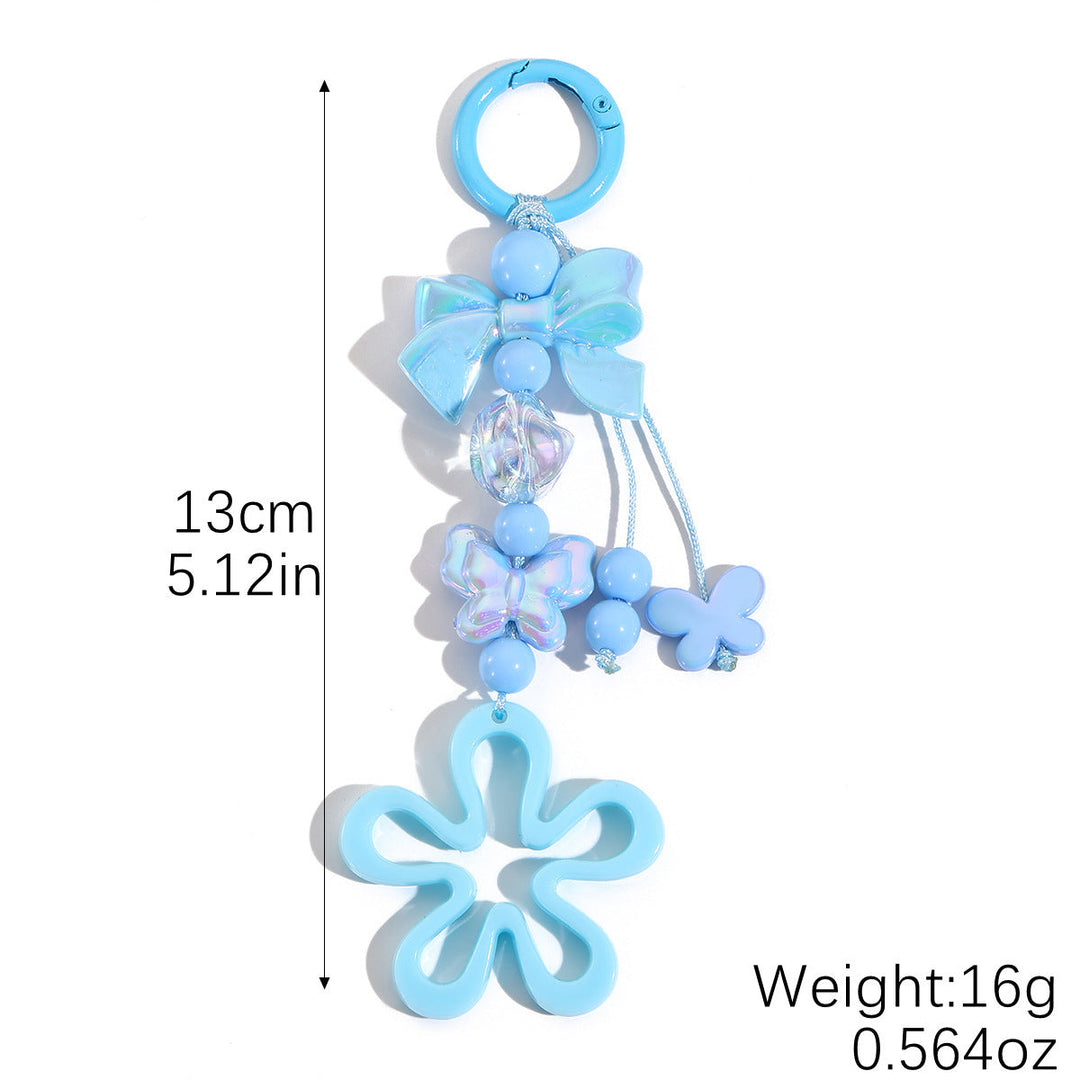 Eye-catching floral butterfly key accessory for bags, made from colorful plastic.