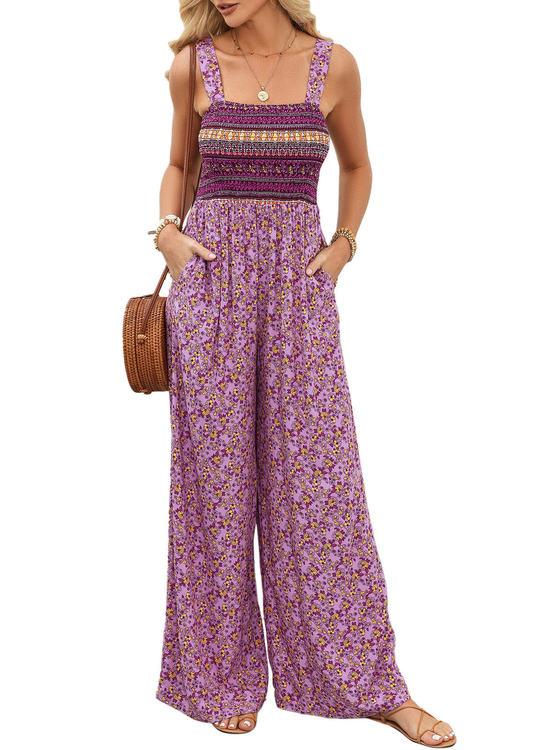 Flowy wide-leg women's jumpsuit with vibrant floral print, perfect for comfortable summer vacation style.