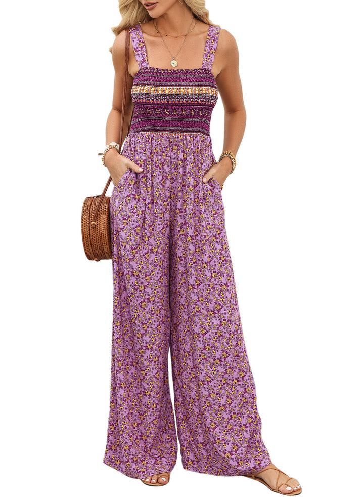 Flowy wide-leg women's jumpsuit with vibrant floral print, perfect for comfortable summer vacation style.