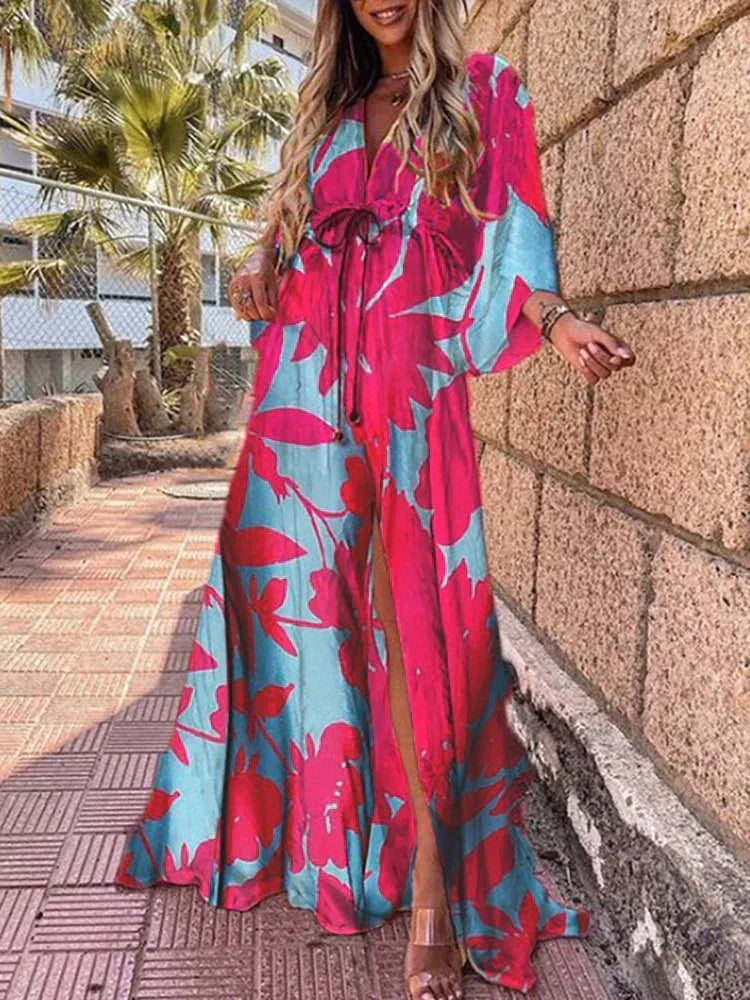 Elegant women's graphic print maxi dress with a high slit, long sleeves, and a flattering flowy design.