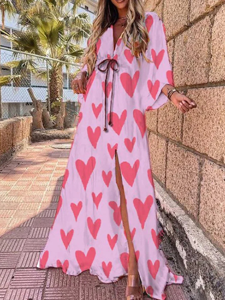 Casual chic women's V-neck maxi dress, featuring a vibrant graphic print, long sleeves, and a stylish high slit.