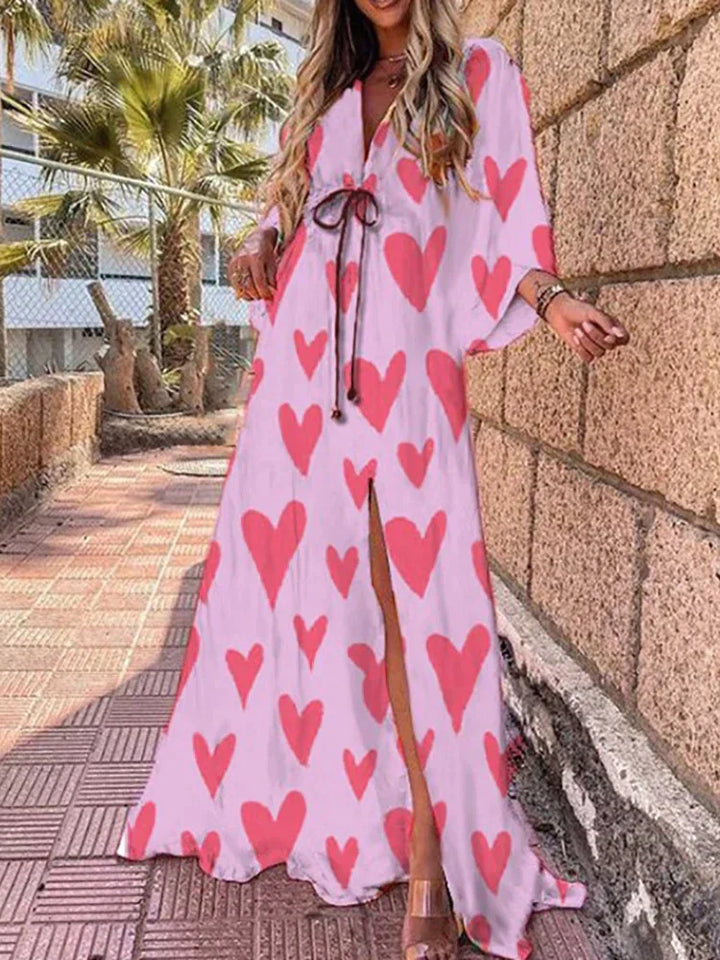 Casual chic women's V-neck maxi dress, featuring a vibrant graphic print, long sleeves, and a stylish high slit.