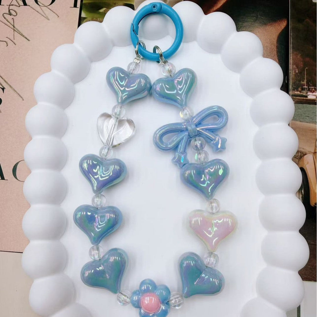 Durable vibrant heart charm keychain for women, colorful iridescent finish. Adds a unique touch to bags & keys.
