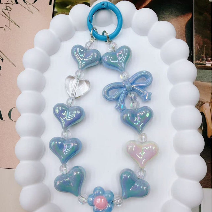 Durable vibrant heart charm keychain for women, colorful iridescent finish. Adds a unique touch to bags & keys.