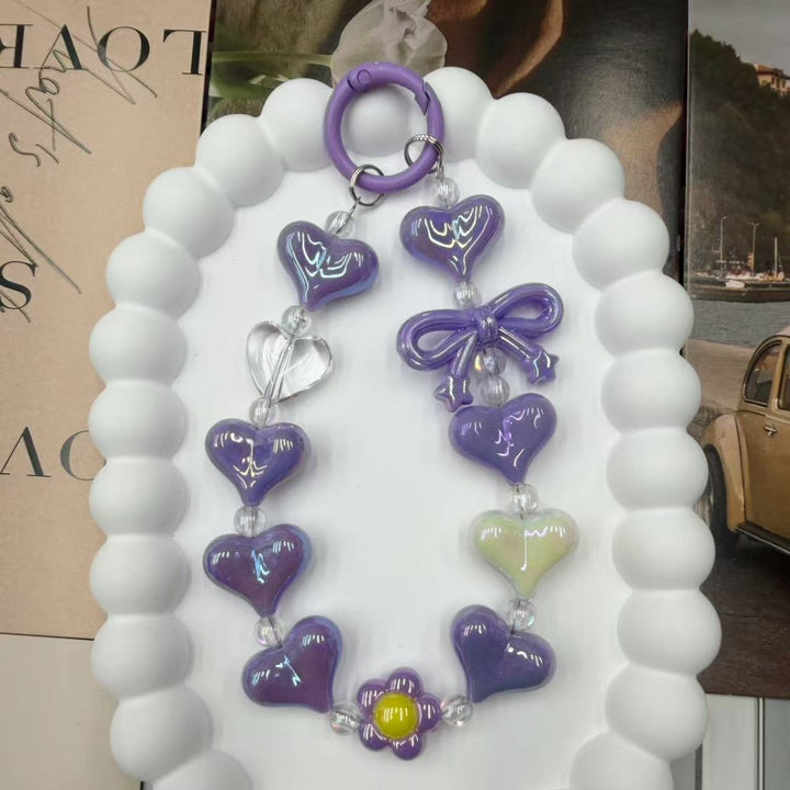 Charming women's heart keychain, iridescent and colorful. A vibrant accessory for bags, keys, or a lovely gift.
