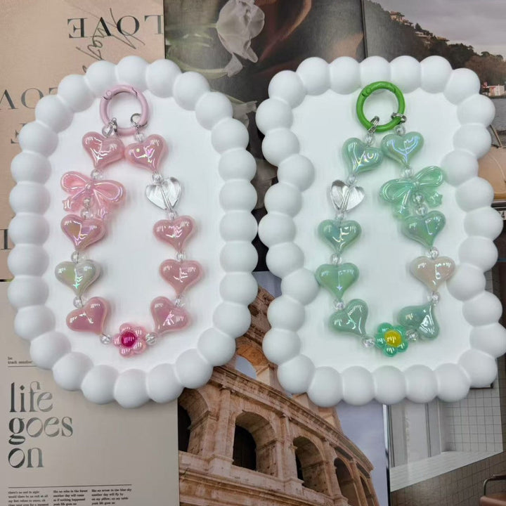 Unique iridescent heart charm keychain, a multi-color accessory for women's bags or keys. Trendy gift idea.